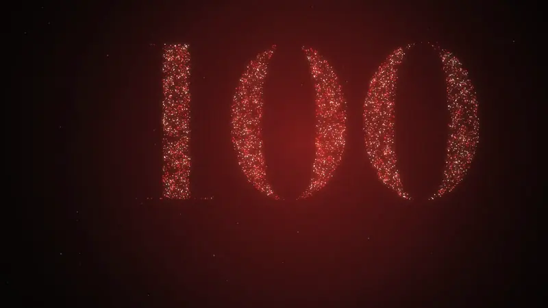 기념식 사진이 입자로 흩어졌다가 「100」으로 다시 모입니다.